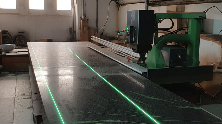 LWPRO green line laser shining on dark granite